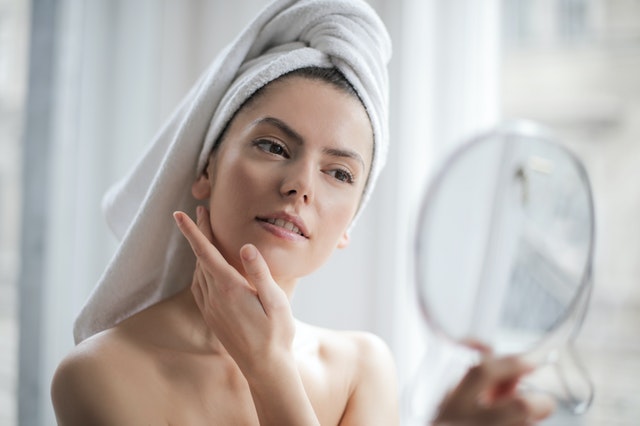 Woman applying bb cream