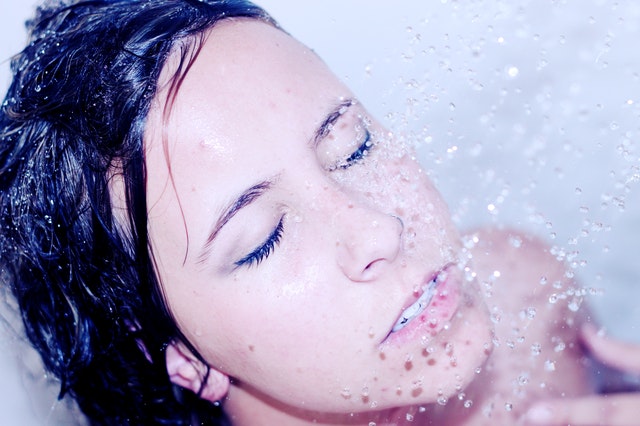 woman having shower on her face