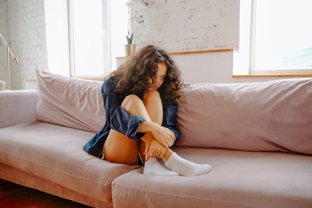 girl sitting on sofa